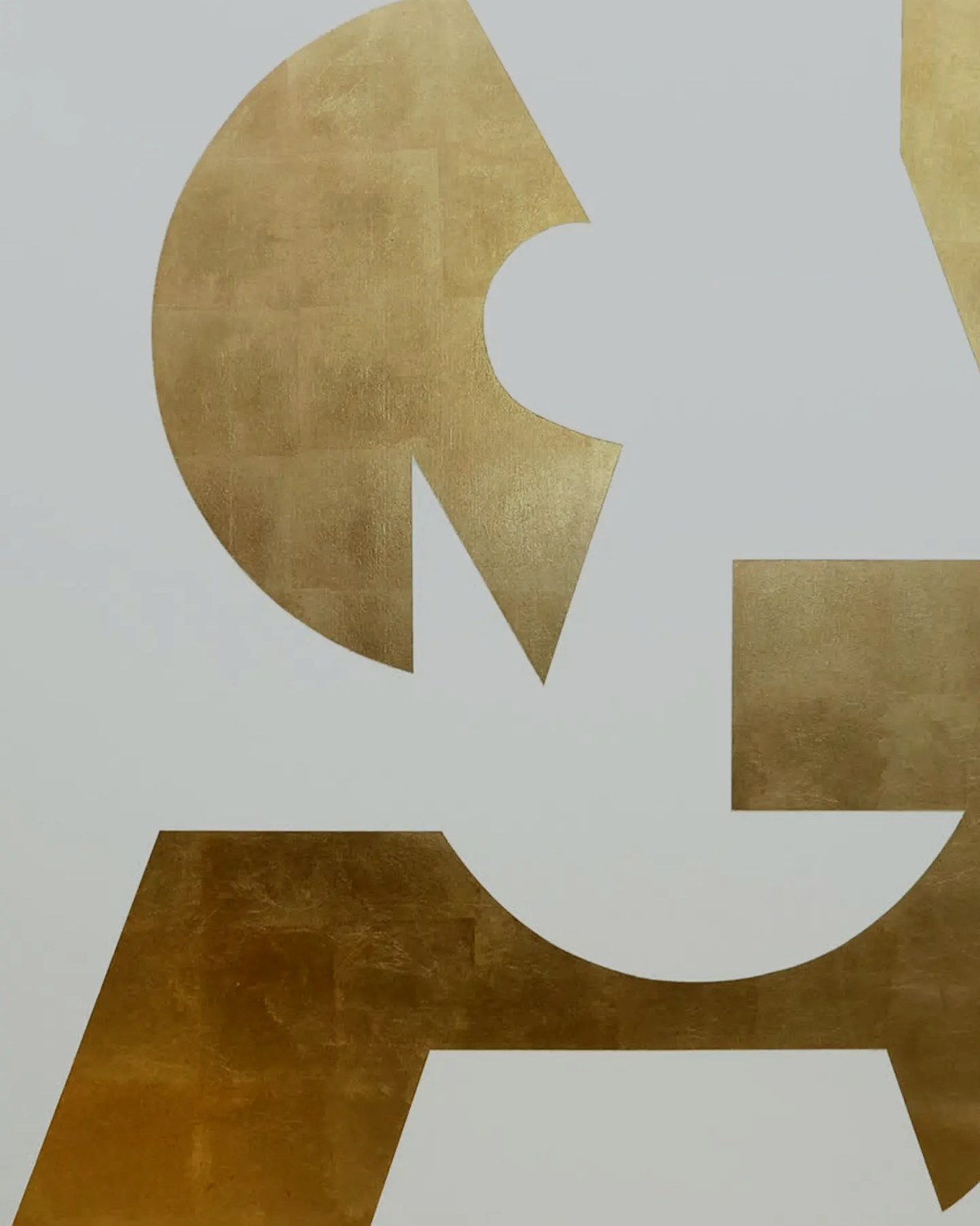 Gold leaf geometric artwork on a white ground