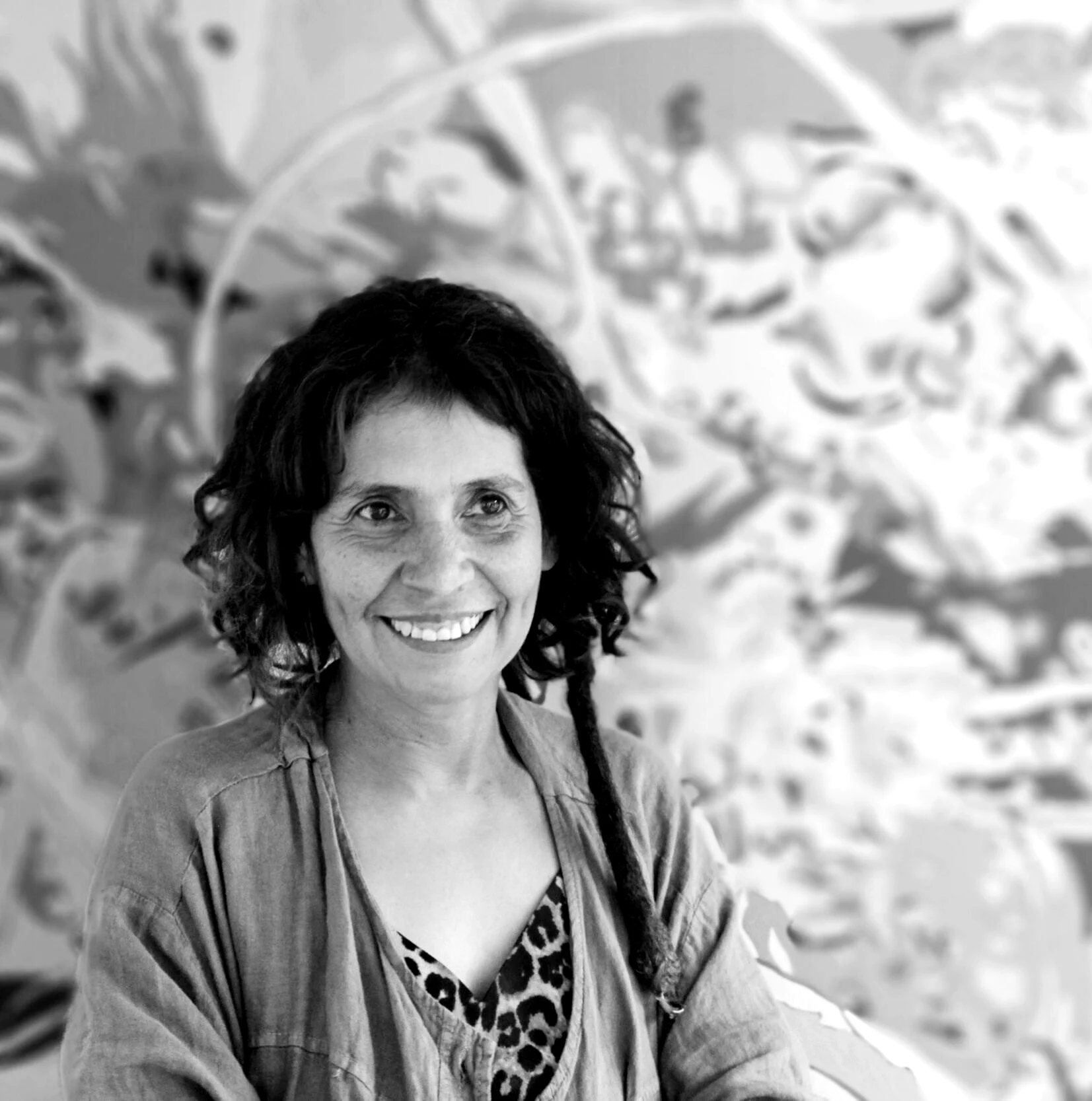 Fernanda Brunet in front of one of her paintings